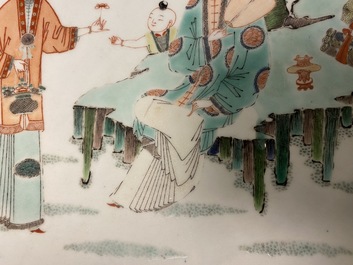 A large Chinese famille verte dish with ladies and boys in a garden, Kangxi